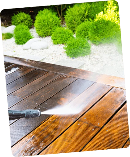 Power washing in action on a wooden deck by Gotta Guy PA, LLC's cleaning services in Lake Ariel, PA.